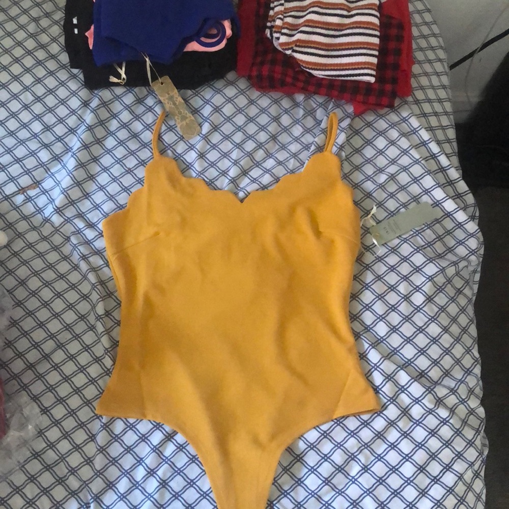 Yellow body suit !